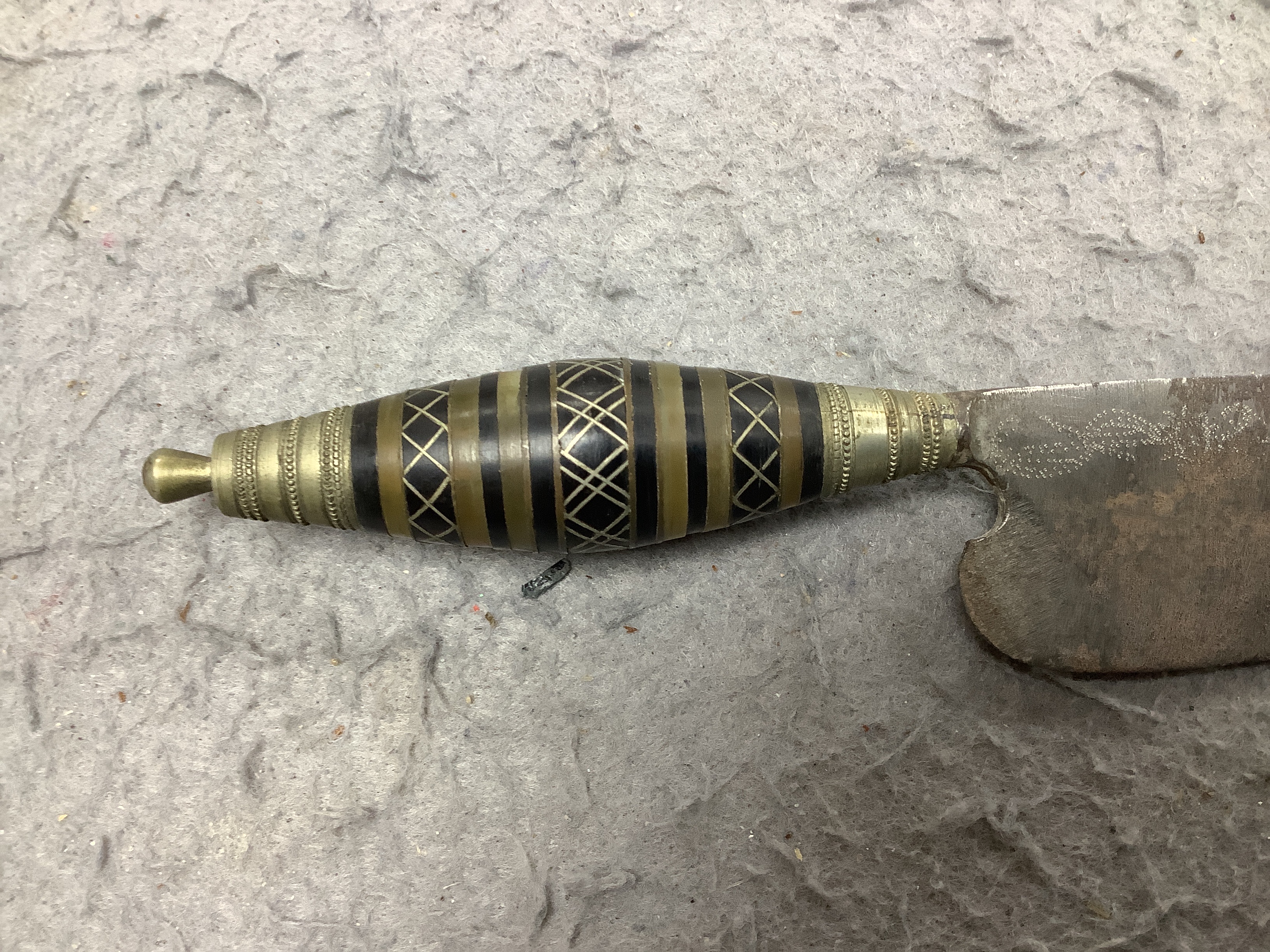 A 19th century Japanese katana with signature to the tang, with chiselled bronze tsuba and gilt metal menuki, and six various knives, blade 57cm